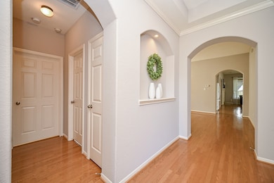 To the left are the two secondary bedrooms, secondary bathroom & the laundry room.  Lovely art niche to showcase all of your special treasures..