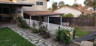 Looking on other side of yard with separate patio.