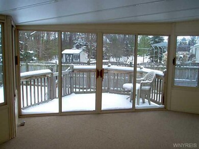 Porch - Enclosed 3 season room of kitchen leads to