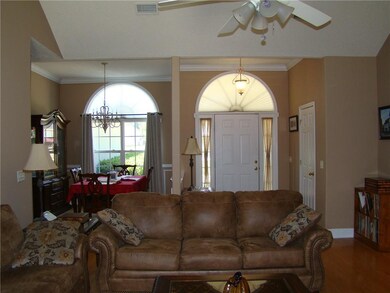 Living Room with Dining Room and Foyer in the back