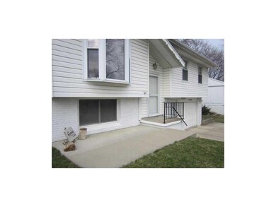 Front Exterior. Poured patio out front.