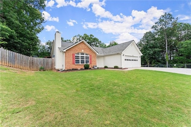Ranch-style home with brick siding, driveway, a chimney, a garage, and a shingled roof