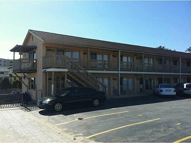 Exterior Front. Parking one car per unit