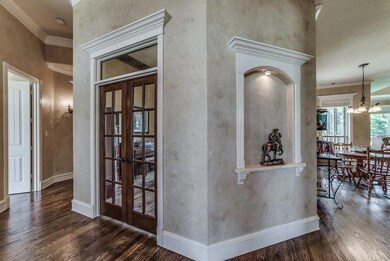 Entry to study has French doors with transom above