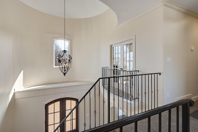 Hall with french doors, plenty of natural light, a