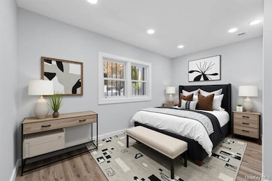 Bedroom featuring recessed lighting and light wood-style flooring