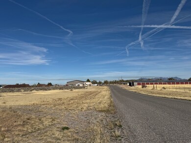 View of asphalt road featuring a rural view