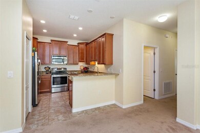 Large closet pantry and breakfast bar open to dini