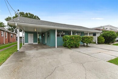 Covered carport with storage room, laundry hookups