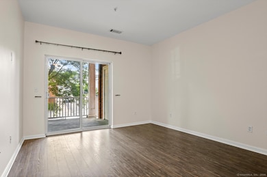 Large primary with sliders to deck, custom closet and en-suite bathroom.