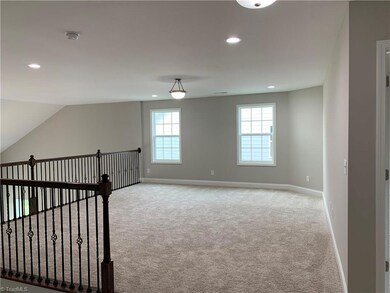 Loft with Wrought Iron Railings overlooks Great Room.