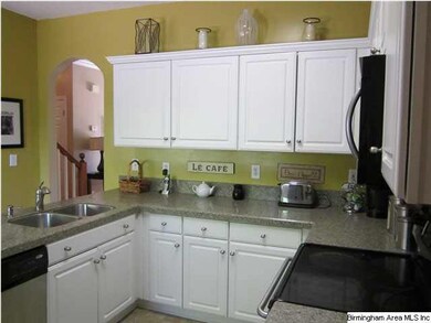 VERY OPEN KITCHEN TO EATING AREA OVERLOOKING FENCE