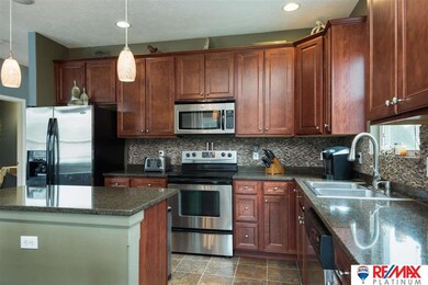 Beautiful and functional kitchen with island, pantry and plenty of counter space.