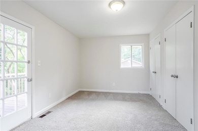 Unfurnished bedroom featuring carpet flooring
