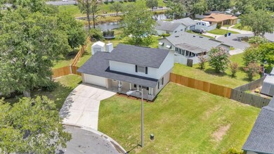 Aerial view of the  front yard, Showing the new fence at the property line.