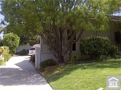 Long Driveway to the detached garage in back.