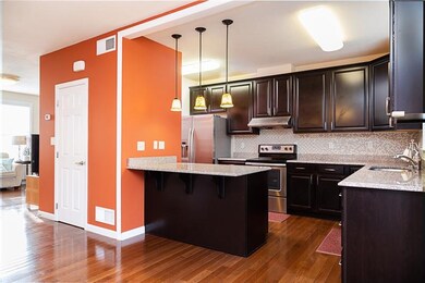 Open floor plan, granite countertops, pendant ligh