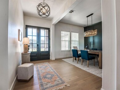 Foyer entrance featuring hardwood / wood-style flo
