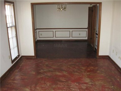 LOOKING ACROSS LIVING ROOM INTO DINING ROOM