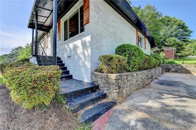 View of side of property with brick siding