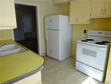 Unit #1 - Kitchen.  The refrigerator pictured is n