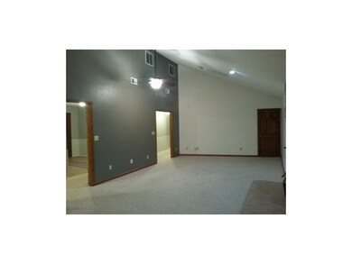 Living room looking to entry and toward bedrooms.
