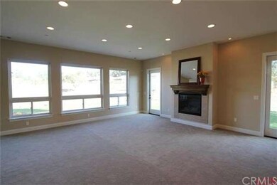 Cozy fireplace overlooks the backyard
