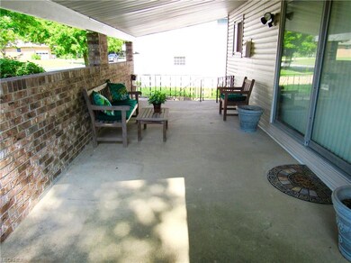 Long open aired covered front porch .