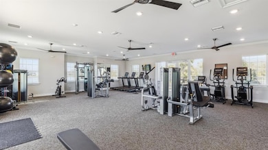 Exercise room featuring ornamental molding and cei