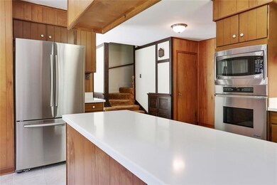 Kitchen.  Stairs lead to upstairs bedrooms.  Guest