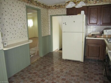 Kitchen another view showing the refrigerator.....