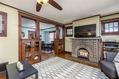 Original fireplace, hardwood floors, built-ins and