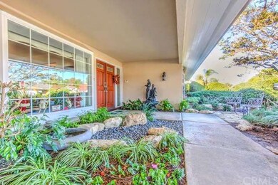 The peaceful front courtyard entry offers  softsca