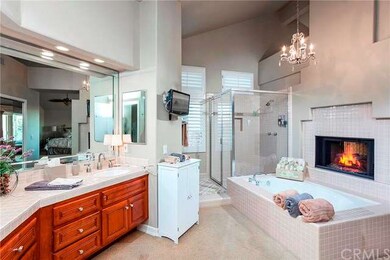 Large spa master bath with cozy fireplace.