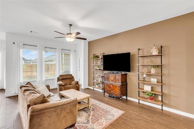 Living room with wood tiled floor, visible vents,