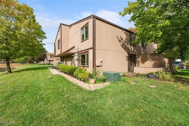 View of home's exterior with a yard