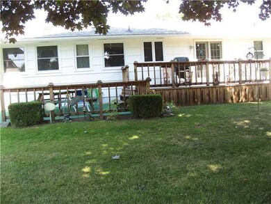 Exterior Back. Lush lawn and a big shade tree for 