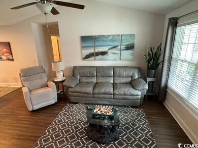 Living room with vaulted ceiling and lots of light