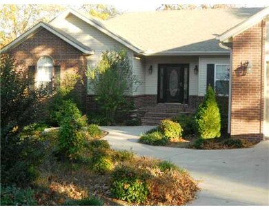 Exterior Front. Wide sidewalks to covered brick en