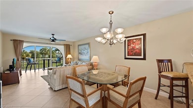 Tiled dining room with ceiling fan with notable ch