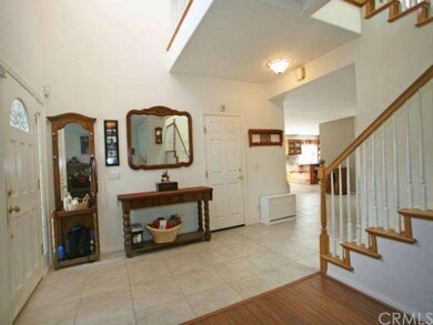 Formal entry way with custom tile flooring through