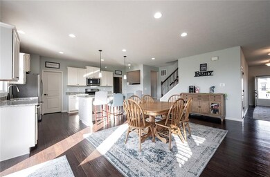 GOURMET KITCHEN INCLUDES: HARDOOD FLOORS, GRANITE TOPS, GAS STOVE, SS APPLIANCES AND A LARGE WALK-IN PANTRY.