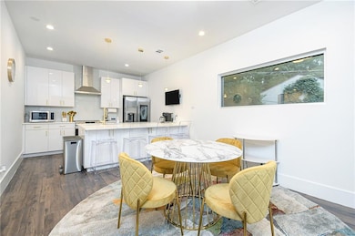 Dining room with baseboards, recessed lighting, an