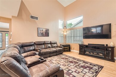 Living room featuring wood finished floors and hig