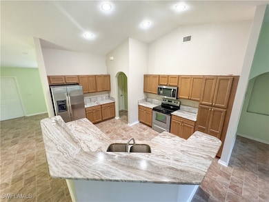 Kitchen featuring appliances with stainless steel