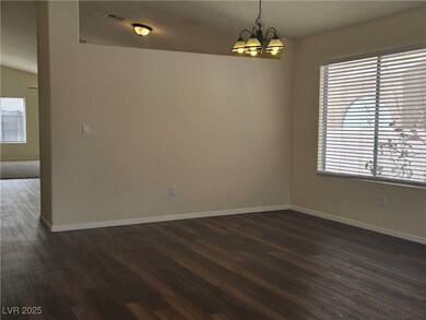 Spare room with dark wood finished floors, baseboa