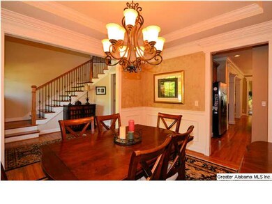 Formal dining room is open to foyer and has easy a