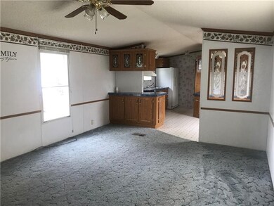 Living room with open floor plan into kitchen/eati