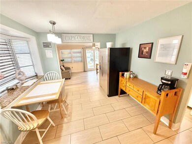 Dining area with light tile patterned flooring