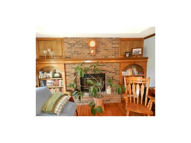 Custom shelving & brick fireplace